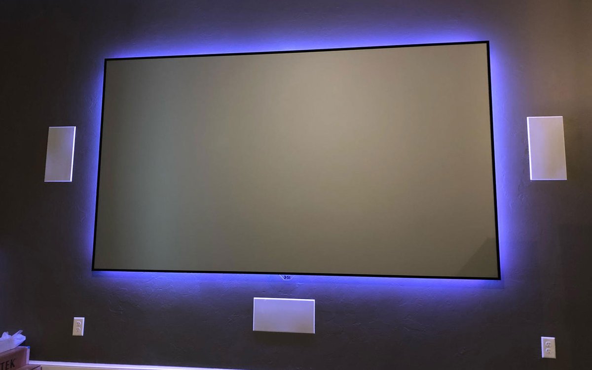Backlit projector screen with in-wall speakers, installed by StarCat Technologies